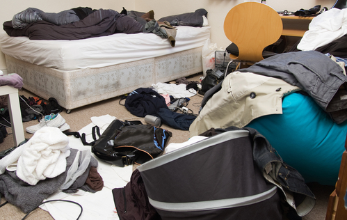 bedroom filthy and dirty. room full of mess with clothes on floor